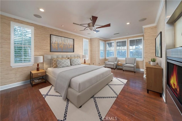 bedroom featuring ornamental molding, ceiling fan, and dark wood-type flooring