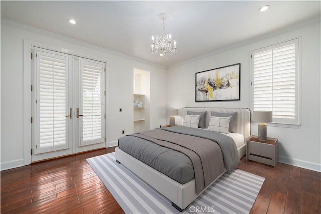 bedroom with an inviting chandelier, ornamental molding, dark wood-type flooring, and multiple windows