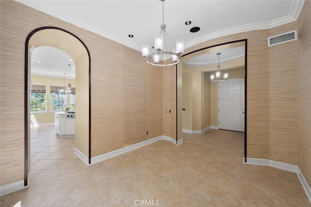 unfurnished dining area featuring ornamental molding and a chandelier