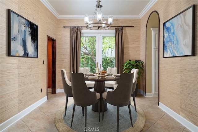 tiled dining area featuring a chandelier and ornamental molding