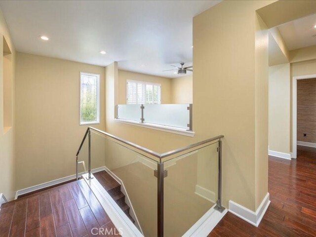 corridor with dark hardwood / wood-style floors