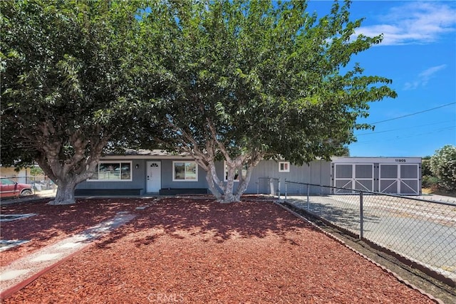 view of front of home featuring fence