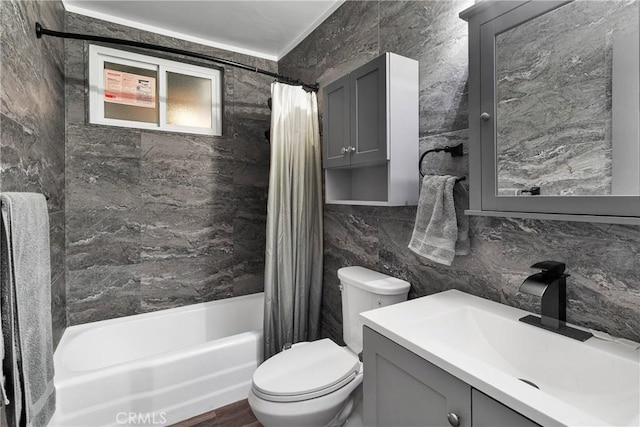 full bath with shower / bathtub combination with curtain, toilet, tasteful backsplash, tile walls, and vanity