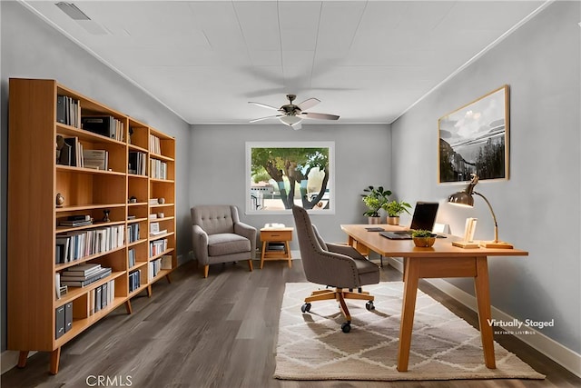 office featuring visible vents, baseboards, wood finished floors, and a ceiling fan