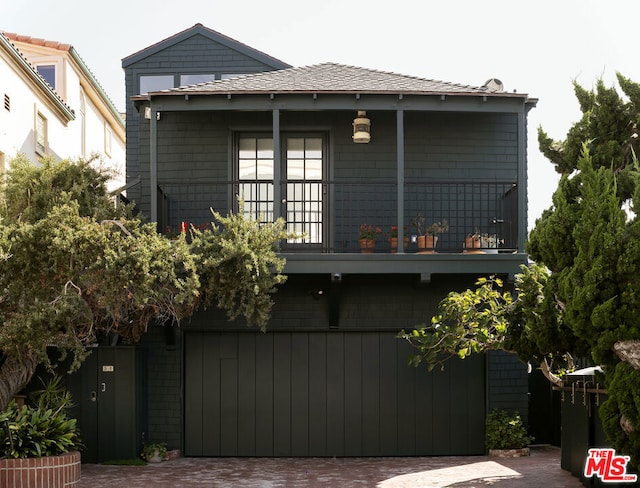 view of front of house featuring a balcony