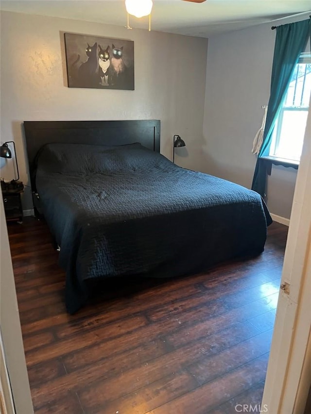 bedroom featuring dark wood-type flooring