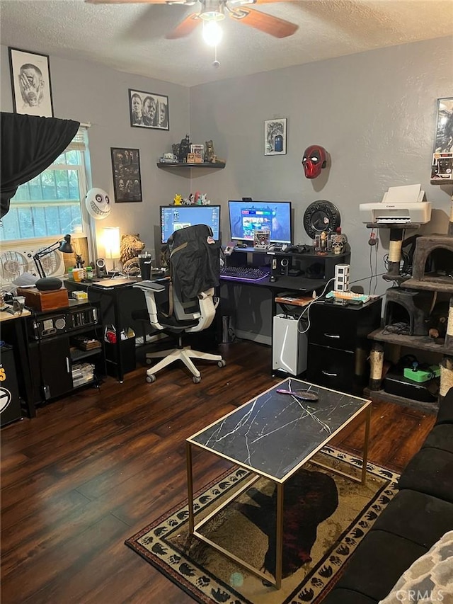 office with a textured ceiling, dark hardwood / wood-style flooring, and ceiling fan