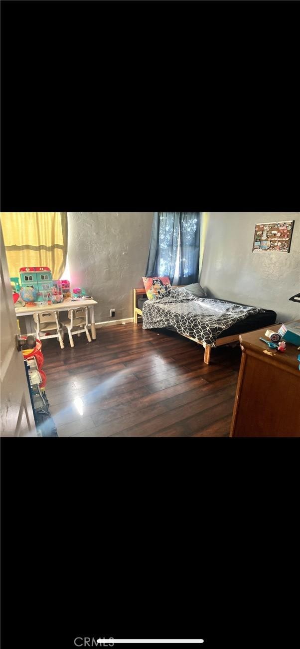 bedroom featuring hardwood / wood-style flooring