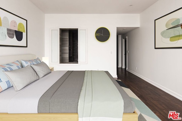 bedroom featuring hardwood / wood-style flooring