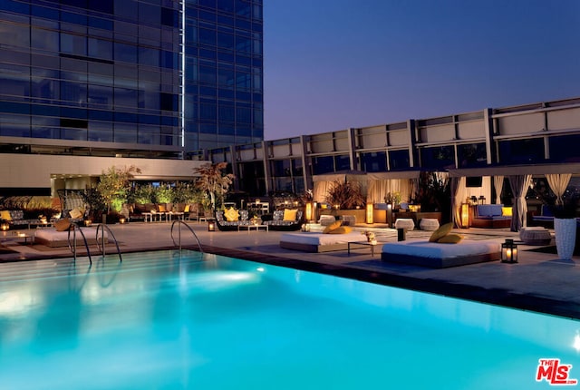 view of pool at dusk