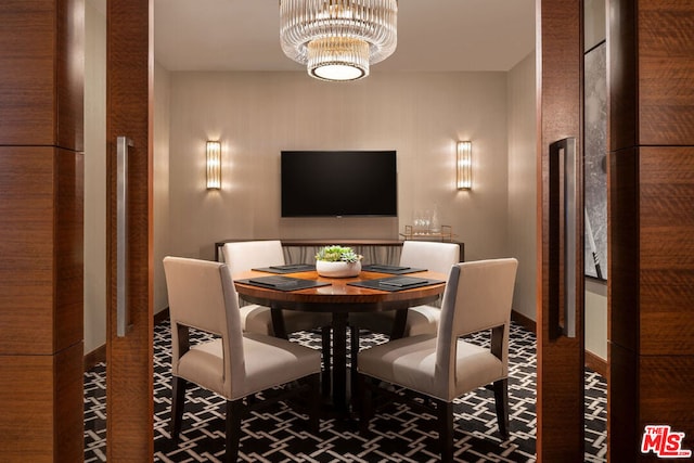 dining space featuring a notable chandelier