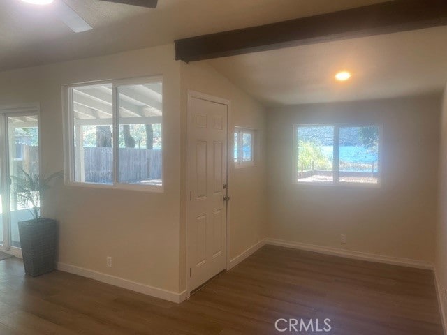 foyer featuring vaulted ceiling with beams, dark hardwood / wood-style floors, and ceiling fan