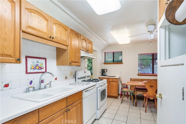 kitchen featuring tasteful backsplash, sink, light tile patterned floors, ceiling fan, and white appliances