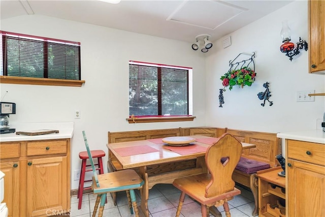 dining area with light tile patterned floors