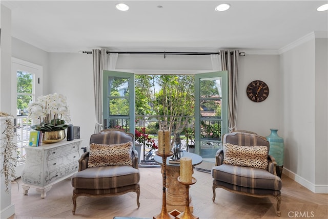 living area featuring ornamental molding