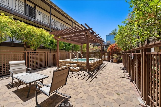 view of patio with a pergola and a hot tub