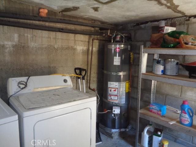 laundry room featuring secured water heater and washer and clothes dryer