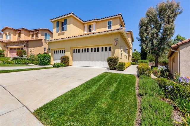 mediterranean / spanish-style home with a front lawn and a garage