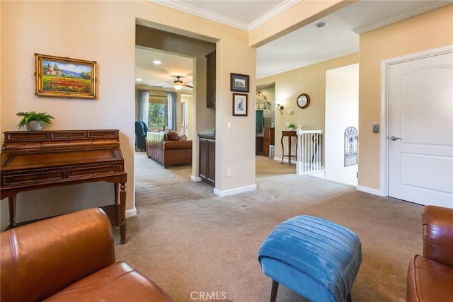 interior space with light carpet, ceiling fan, and ornamental molding