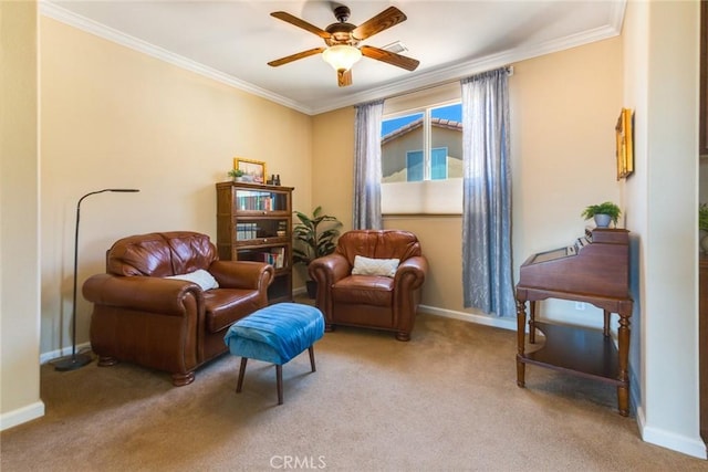 sitting room with light colored carpet, ceiling fan, and ornamental molding