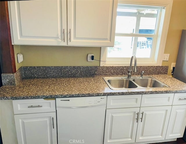 kitchen featuring dishwasher, white cabinetry, and sink