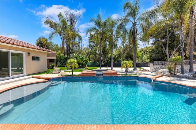 view of pool featuring an in ground hot tub and a patio area