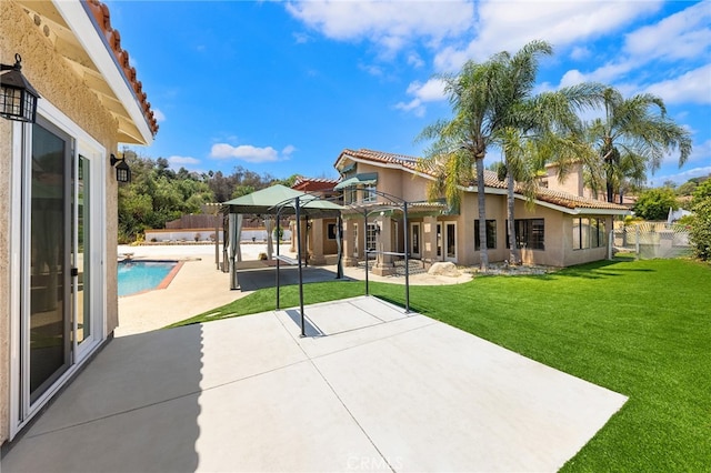 exterior space featuring a lawn and a patio