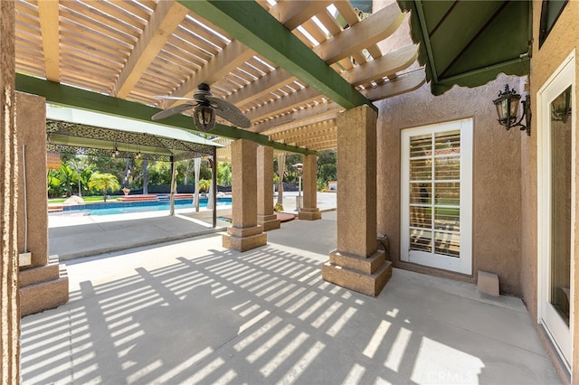 view of patio / terrace featuring ceiling fan and a pergola