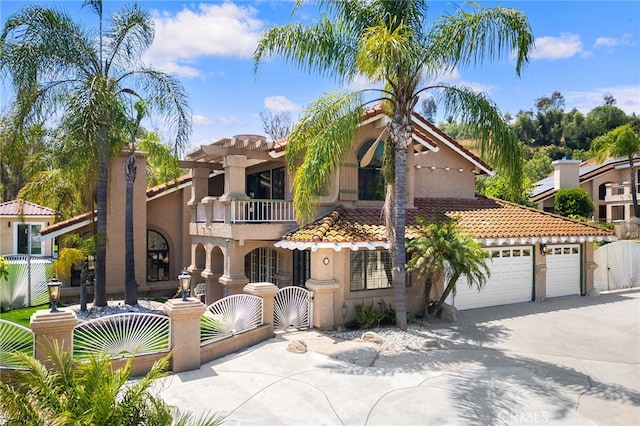 mediterranean / spanish-style home featuring a balcony and a garage