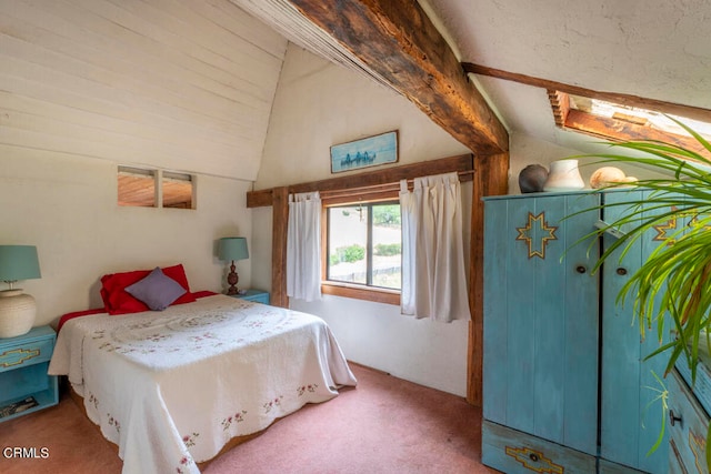 bedroom with carpet floors and lofted ceiling