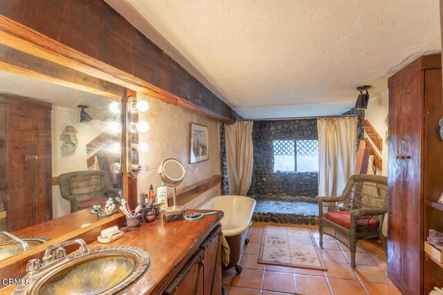 bathroom with vanity, shower with separate bathtub, and tile patterned floors