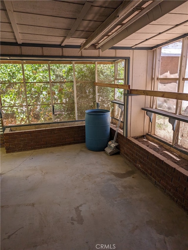 unfurnished sunroom with plenty of natural light