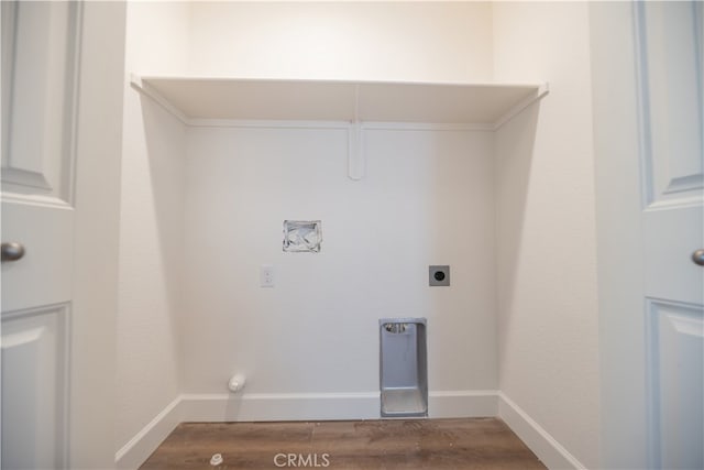 washroom featuring hardwood / wood-style floors, electric dryer hookup, and gas dryer hookup