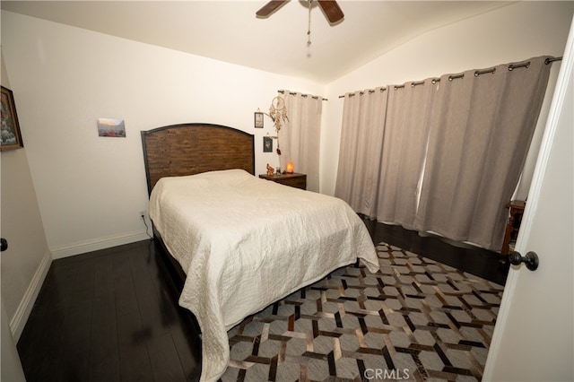 bedroom featuring ceiling fan, vaulted ceiling, and dark hardwood / wood-style flooring