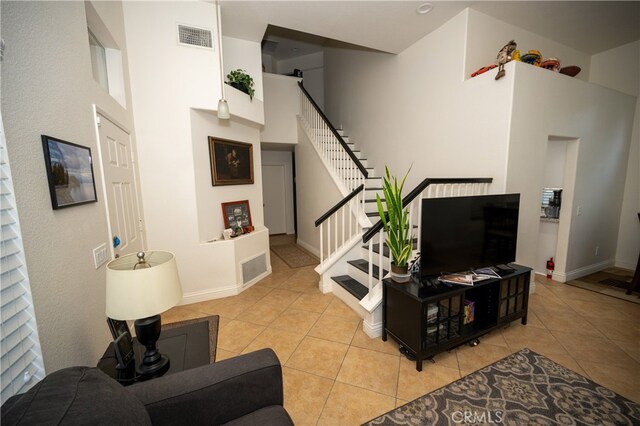 living room with light tile patterned flooring