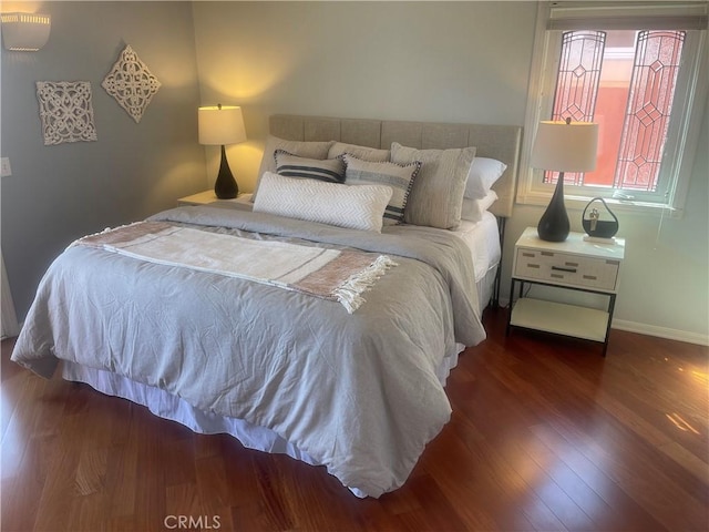 bedroom featuring dark wood-type flooring