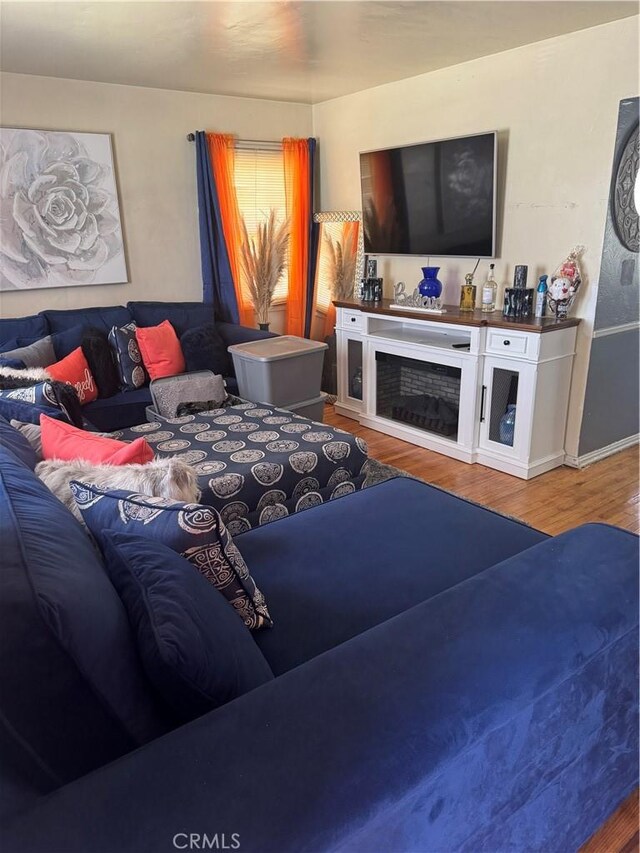 2016 W 103rd St, Los Angeles, CA 90047 - living area with wood finished floors and a fireplace