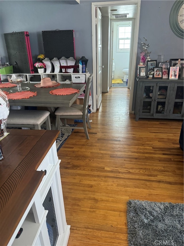 dining room with wood-type flooring