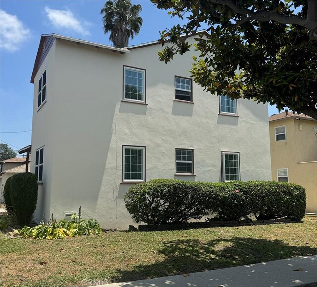 2016 W 103rd St, Los Angeles, CA 90047 - view of home's exterior with stucco siding