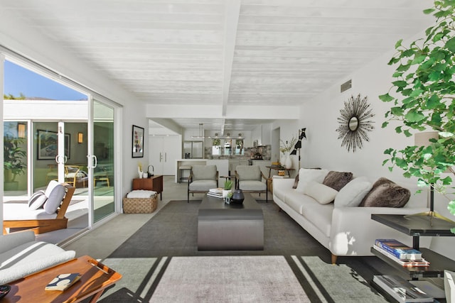 living room with beamed ceiling