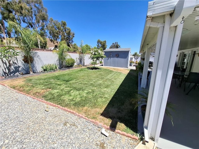 view of yard with a storage unit