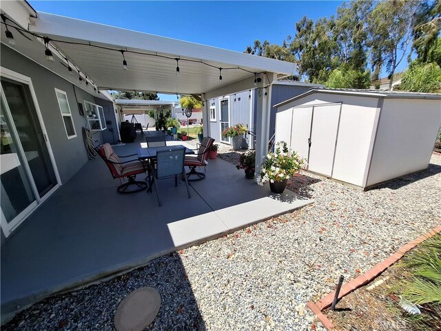 view of patio featuring a shed