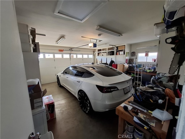 garage featuring a garage door opener