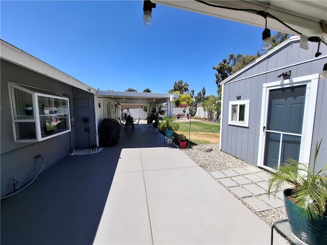 view of patio / terrace featuring a carport