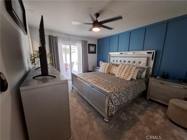 carpeted bedroom featuring ceiling fan and access to exterior