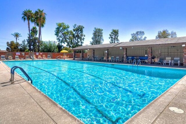 view of pool featuring a patio