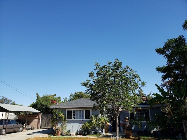 view of front of home with a carport