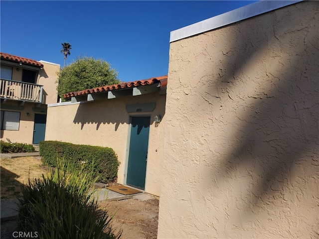 entrance to property with a balcony