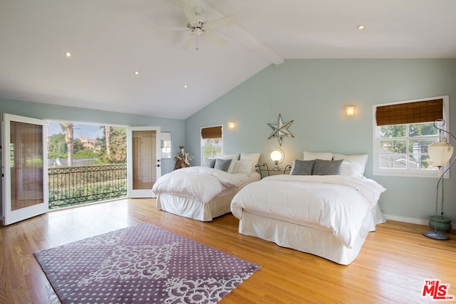 bedroom featuring access to outside, multiple windows, and light wood-type flooring