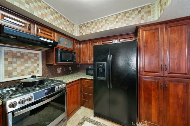 kitchen with decorative backsplash, light tile patterned flooring, light stone countertops, ventilation hood, and black appliances